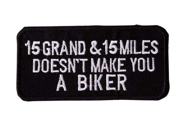 Front view of a black embroidered biker patch featuring white stitching