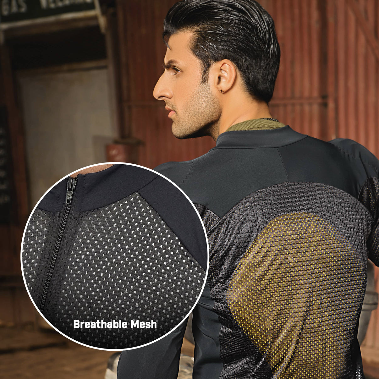 A model wears a black mesh motorcycle riding shirt with mesh panels and a full-length front zip
