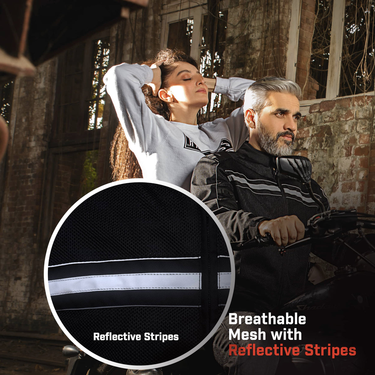 Worn by a model, this black mesh motorcycle jacket features reflective striping and a 600D shell