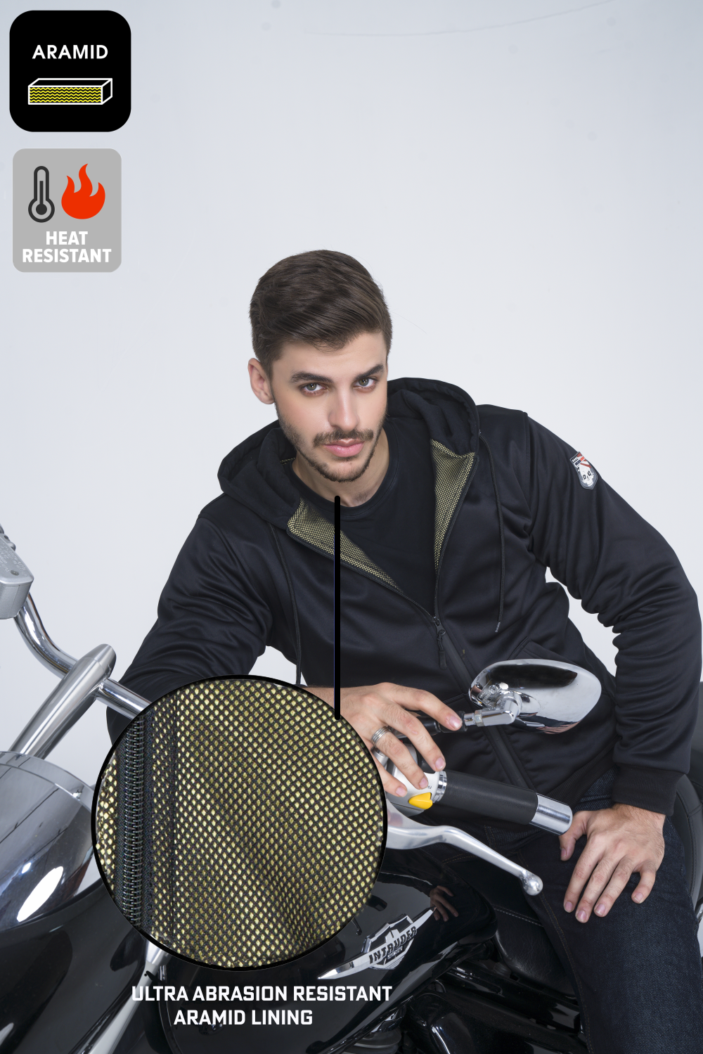 Model wearing a black armored motorcycle hoodie with YKK zippers, aramid lining, and CE Level 2 armor