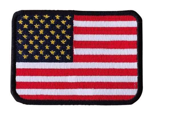 Front view of a red, white, blue, and black embroidered biker patch with border stitching