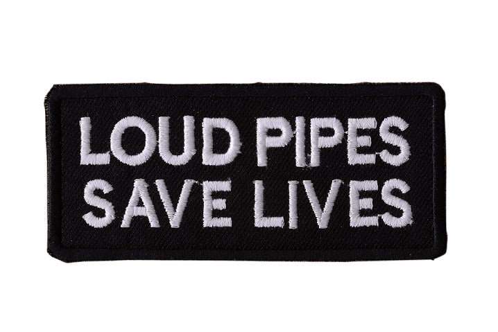 Close-up of a black embroidered biker patch featuring white stitched text and borders