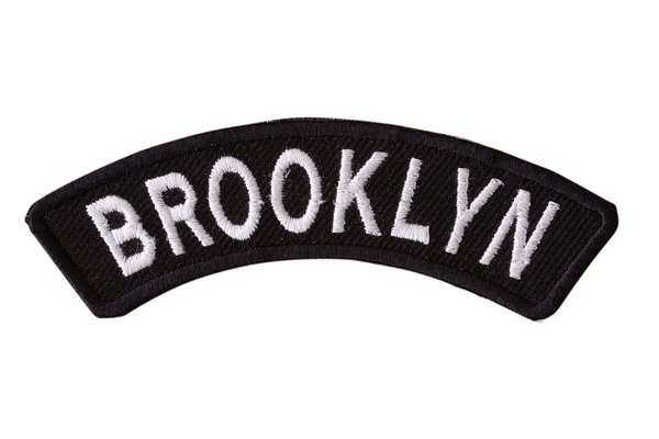 Front view of a curved black embroidered biker patch featuring white stitching