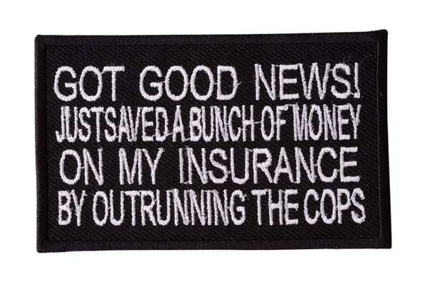 Close-up of a black embroidered biker patch with white stitching