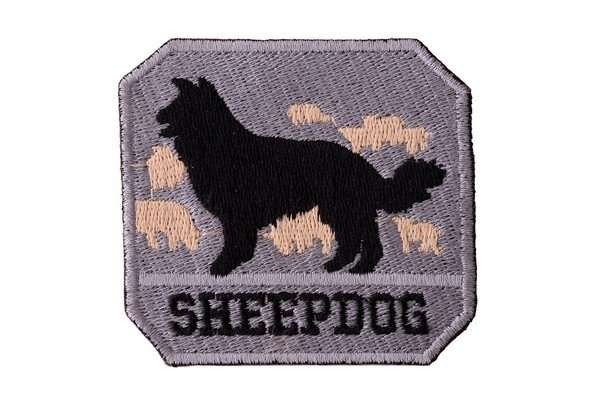 Close-up of the gray embroidered biker patch with dense stitching and a black border