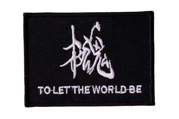 A black embroidered biker patch features white stitching and text