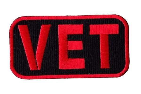 Close-up front view of an embroidered biker patch featuring red text on a black background