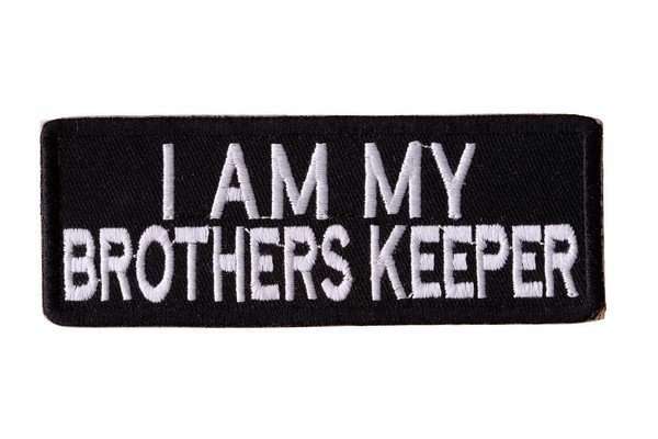Close-up of a black embroidered biker patch with white stitched text