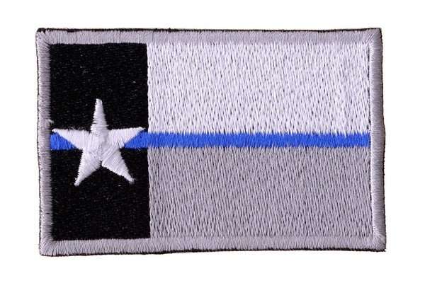Front view of a black, white, and blue embroidered biker patch with dense stitching