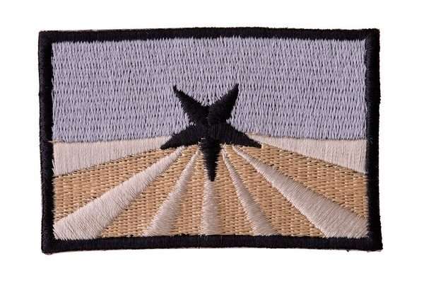 Front view of an embroidered biker patch with blue, beige, and black stitching