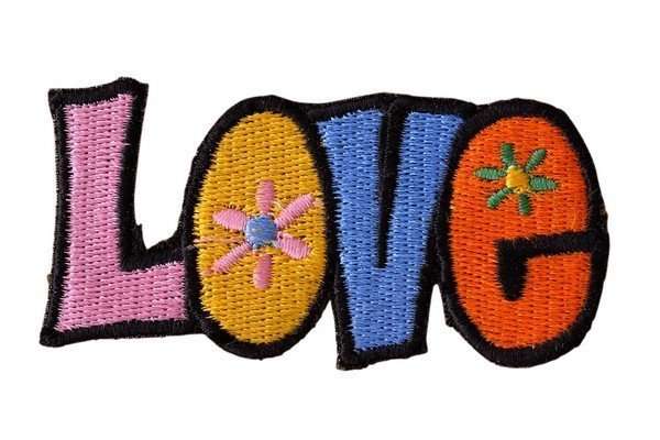 Close-up of a multicolored embroidered biker patch with black stitching