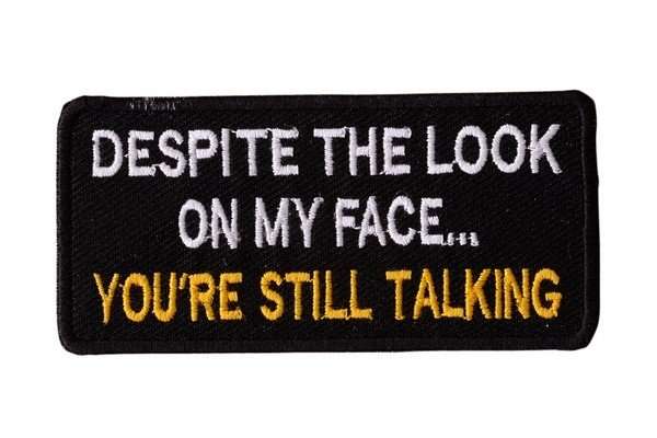 Front view of a black embroidered biker patch with white and yellow stitching