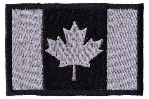 Close-up front view of a black and grey embroidered biker patch with stitching details