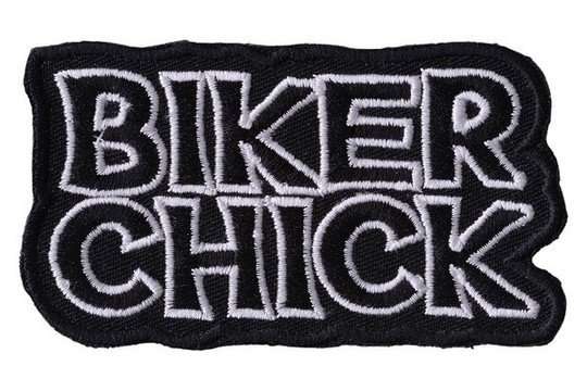A black and white embroidered biker patch features text stitching